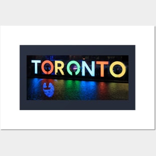 Toronto Sign All Lit Up With Umbrella Silhoette Posters and Art